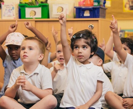 Hillside pupils sitting on infant mats