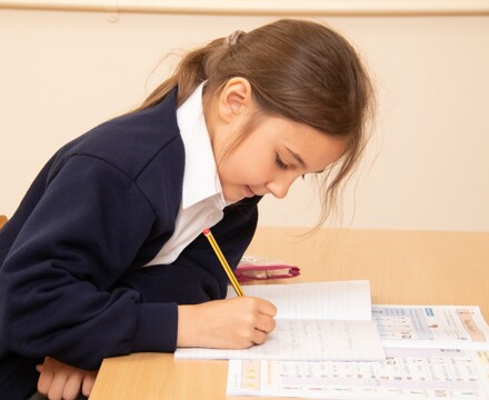 lambs lane pupil concentrating on classwork