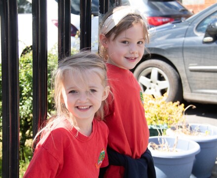 lambs lane pupils happily sitting outside