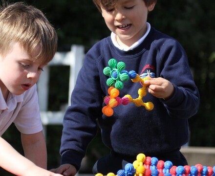 Radstock pupils outside playing with shapes