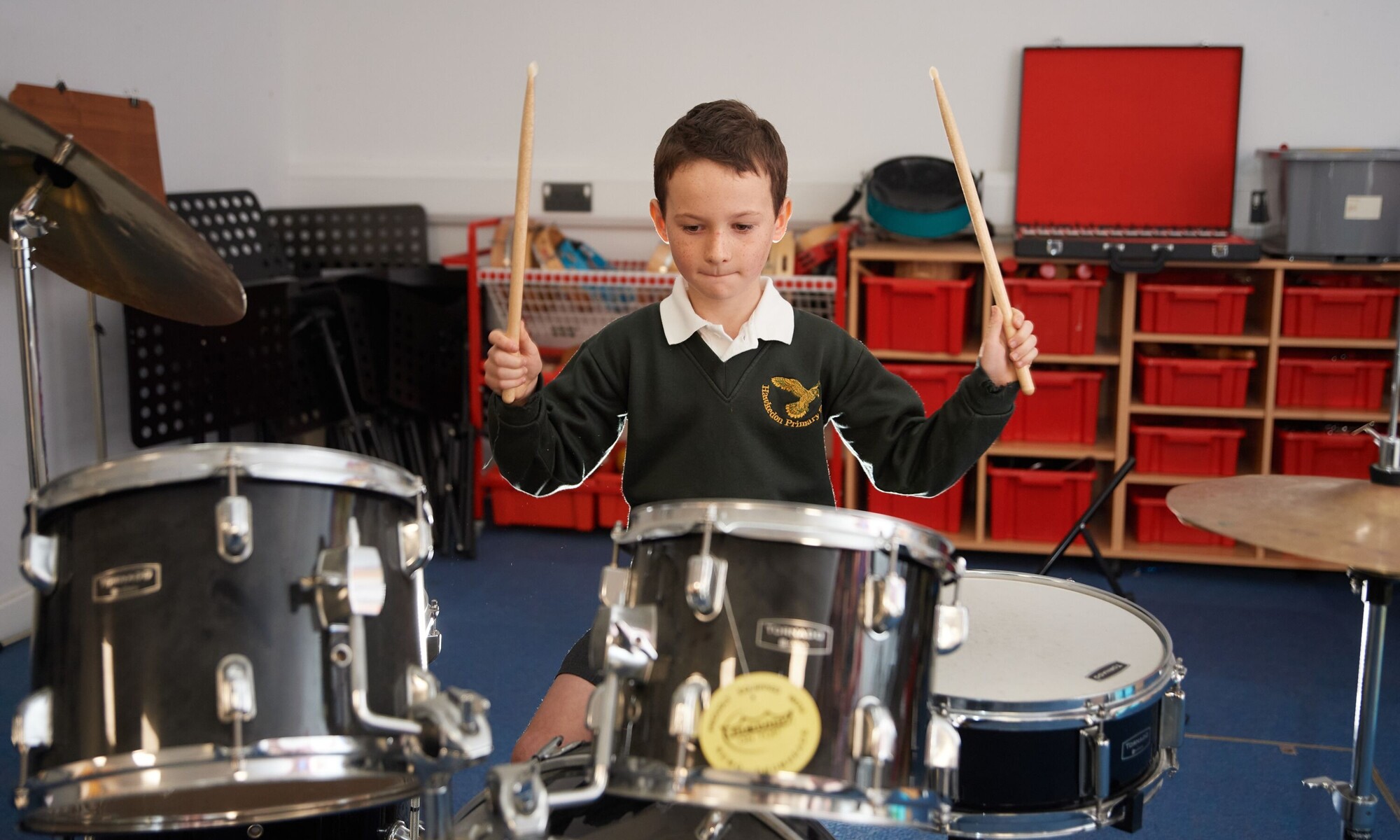 Hawkedon pupil playing drums